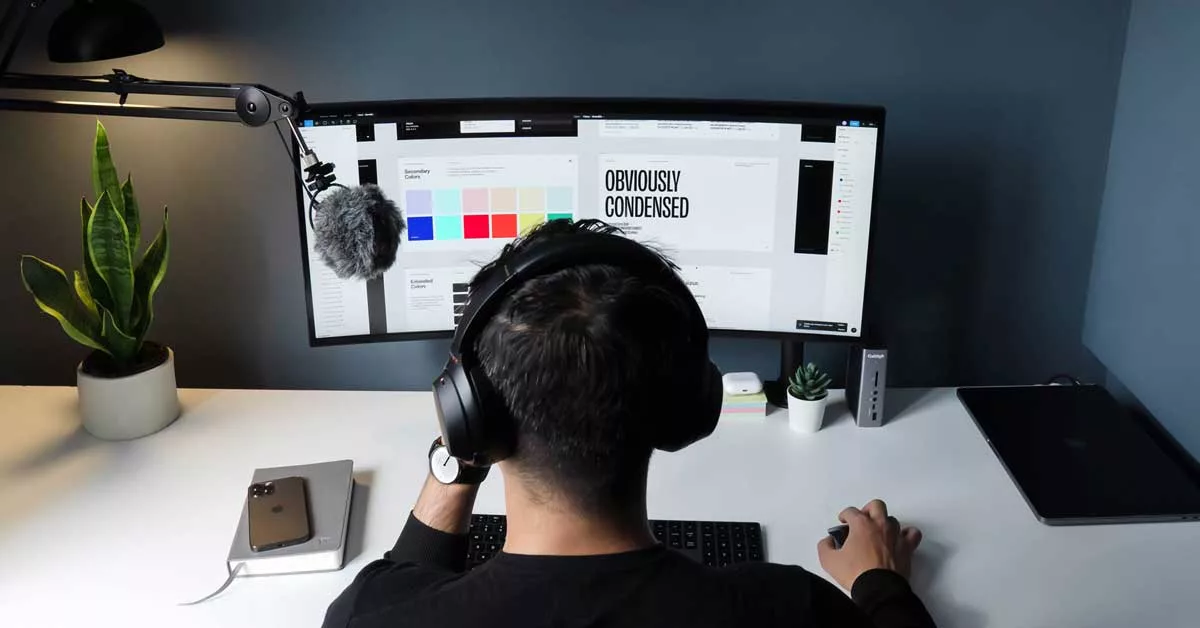 Man sitting at company thinking about his limited company vs sole trader options for his new design company.