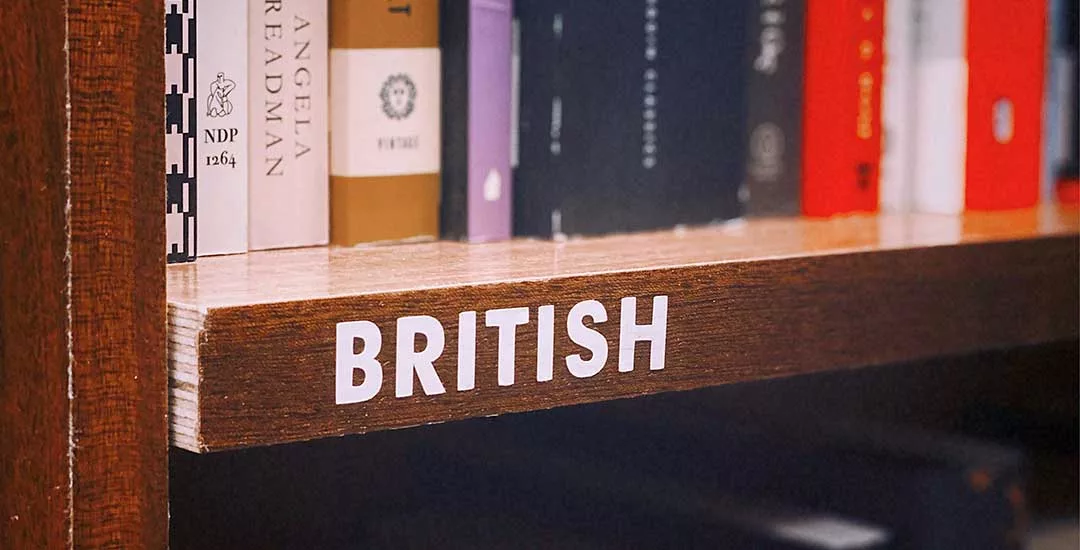 Library shelf with British written on it and books above