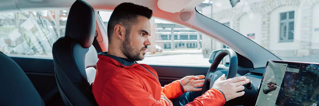 A person driving a zero CO2 emissions car
