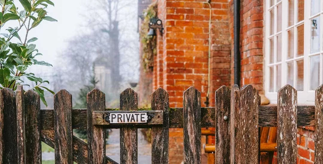 wooden fence with private sign of it