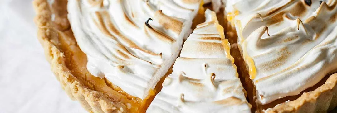 image of a slice of a lemon meringue pie illustrating dividend income tax rates. 