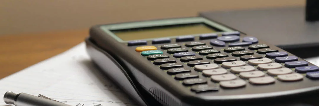 An image showing a calculator and a document with the title Contractor Mortgages - important for evaluating interest rates.