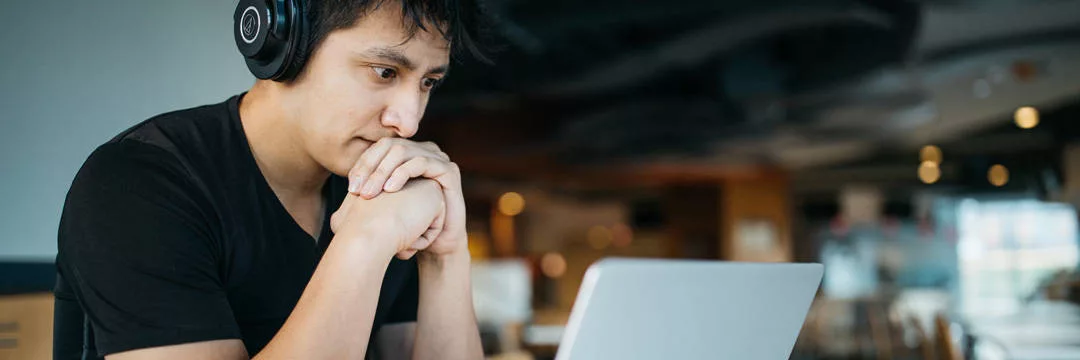 A person using a computer to manage their VAT responsibilities