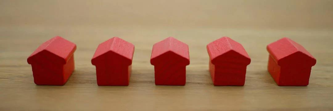 red monopoly rental houses lined up