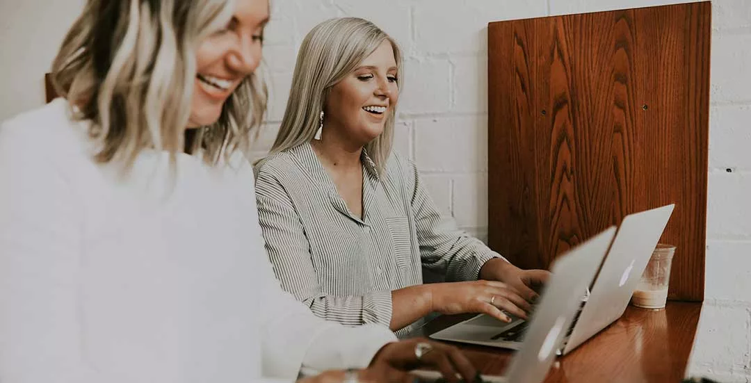 an employer and employee working side by side on their laptops - who meets the eligibility criteria for employment allowance eligibility in 2025.