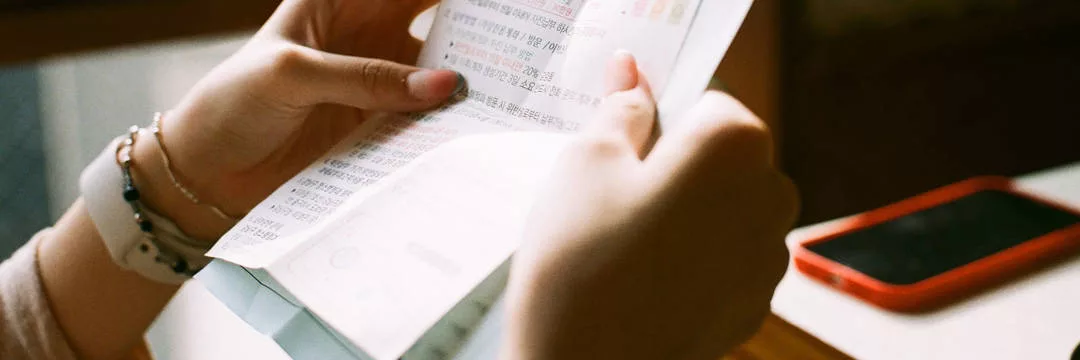 A person looking at their pre-registration expenses to reclaim VAT