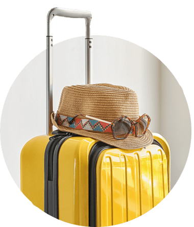 A yellow suitcase with hat showing that a good contractor accountant can free up more of your time.