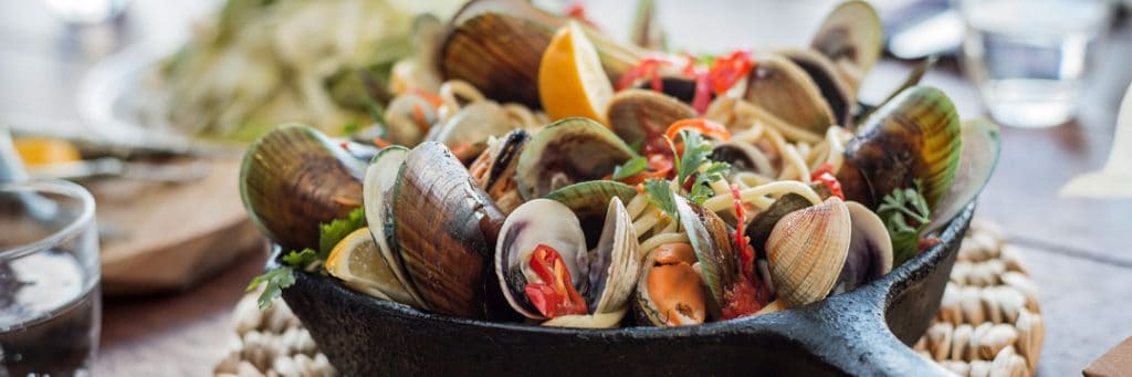 A steaming mussel pot always makes tax advice for Kiwis tastier