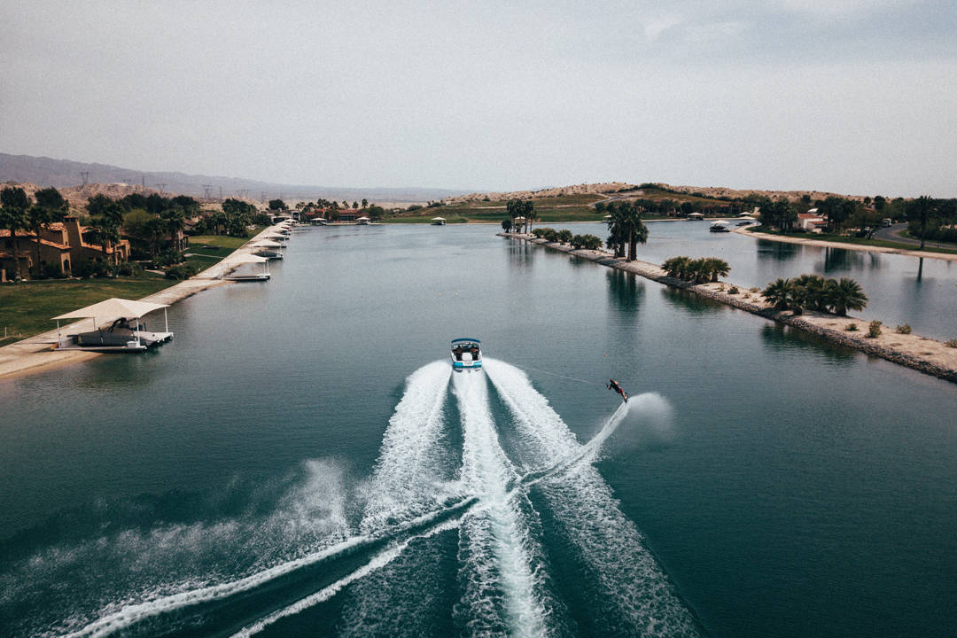 Man waterskiing having just completed a bank reconciliation with his accounting software