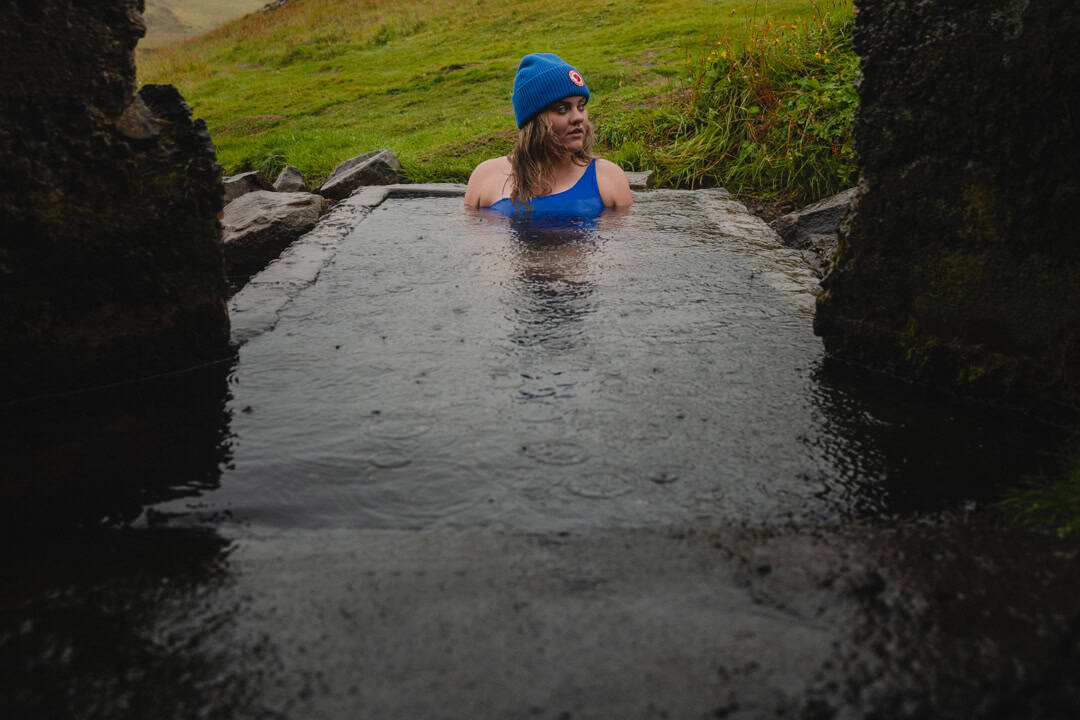 A sole trader taking a break from business by taking a cold water plunge