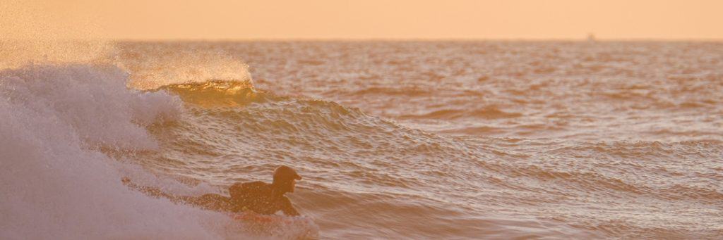 Having just completed his personal tax return online, it was time to Jamie to body board some waves at sunset 