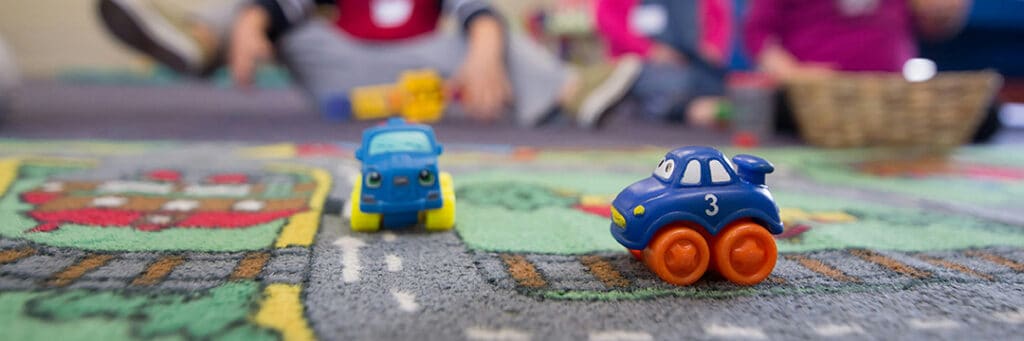 toy cars on a play mat