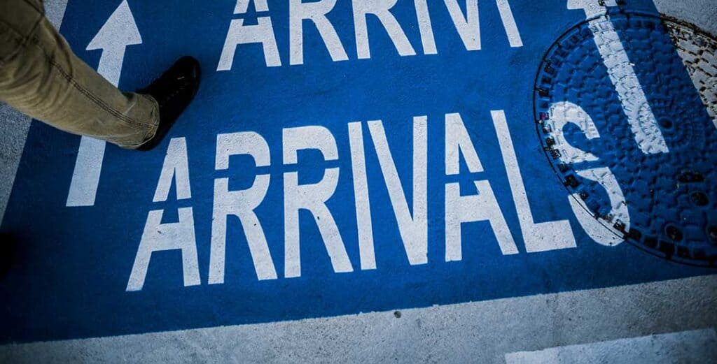 arrival sign on floor of airport