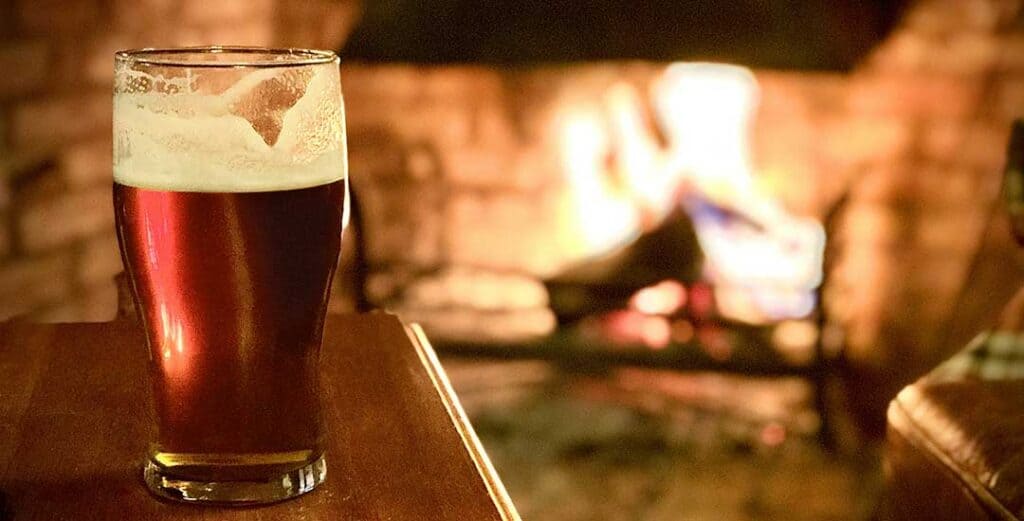 A British Pint with fire in background
